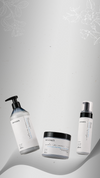 Tre prodotti argentati Maraes Lamino Care su sfondo grigio chiaro con elementi botanici
