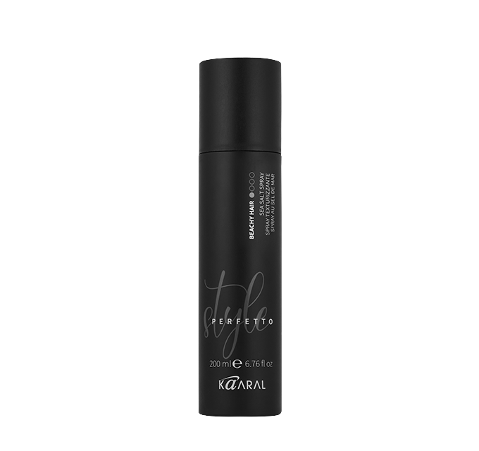 Tall black hair styling bottle on a black background