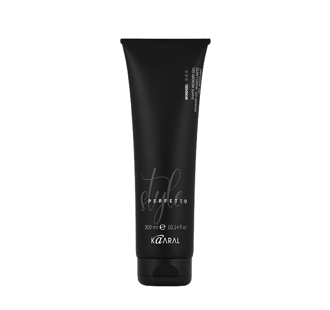 Black haircare squeeze tube on a black background