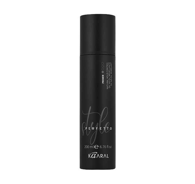 Tall black hair styling bottle on a black background