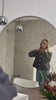 Woman taking a mirror selfie indoors